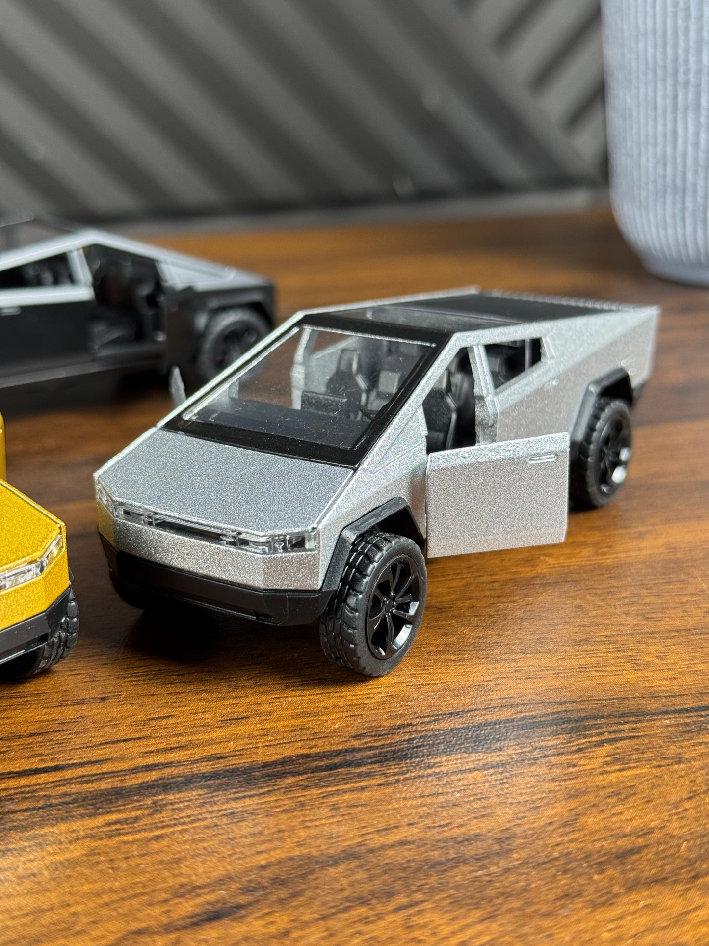 Model of a futuristic truck on a wooden surface